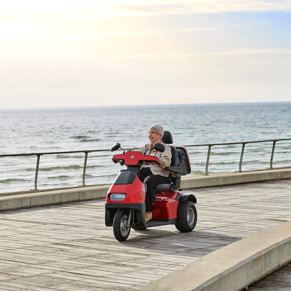 Red Afiscooter S3 Off-road in beach side lifestyle image